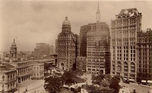 The New York World, Herald and Times, from left to right, across from City Hall. The New York World building was demolished in 1955 to rebuild the approach to the Brooklyn Bridge.